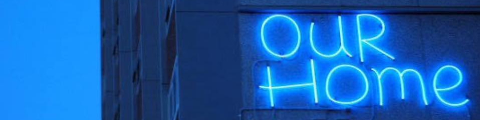 Our Home neon sign at Atherton Gardens